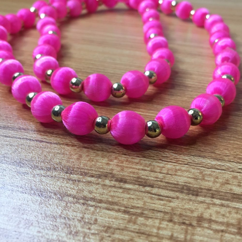 Pink and gold bead necklace